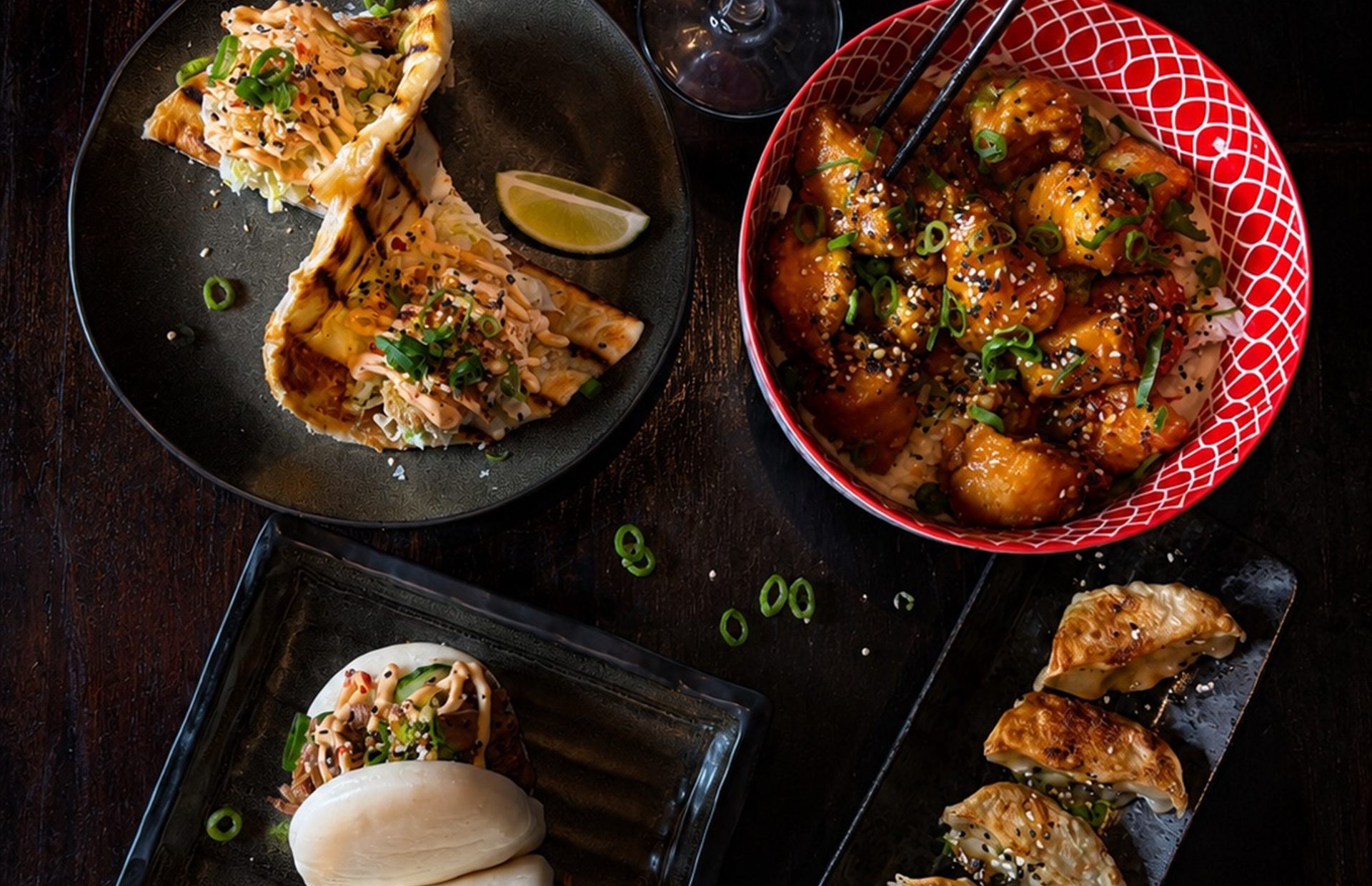 Overhead shot of shared dishes at Fu Manchu Oriental